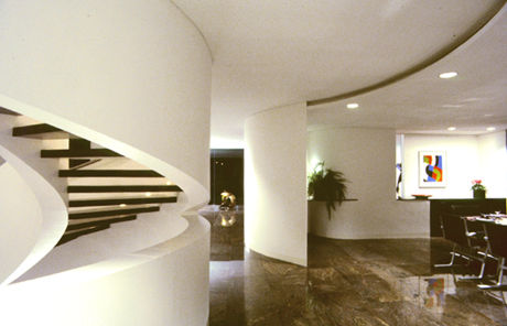 The living-dining space and open air spiral stair