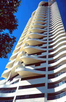 Upward view of tower with reversed plan staggered balconies