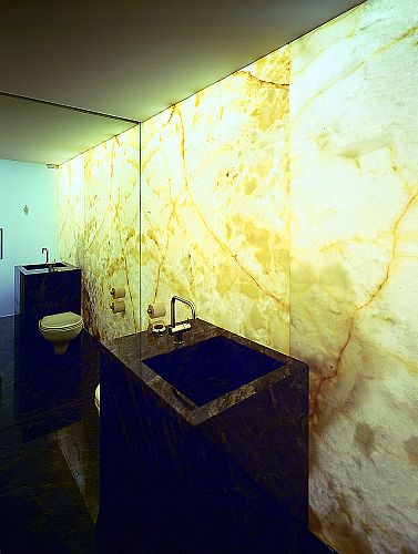 Internally illumated full height onyx wall to bathrooms