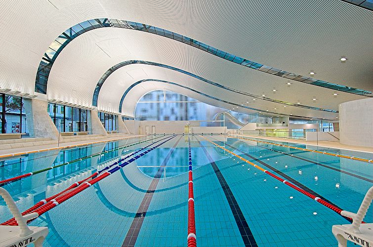 Interior of 50 m pool with wave shaped curved roof