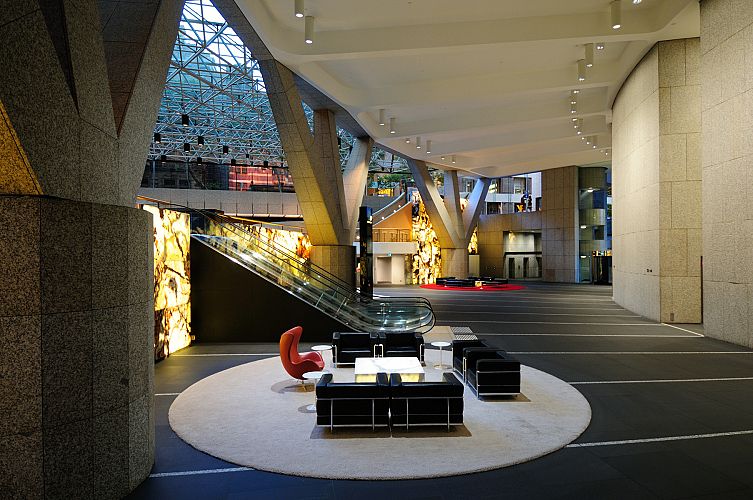 View of Lobby with internally illuminated Onyx Wall at change of Level to Upper Lobby
