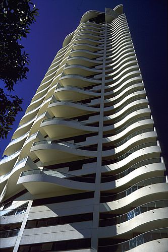 Upward view of tower with reversed plan staggered balconies